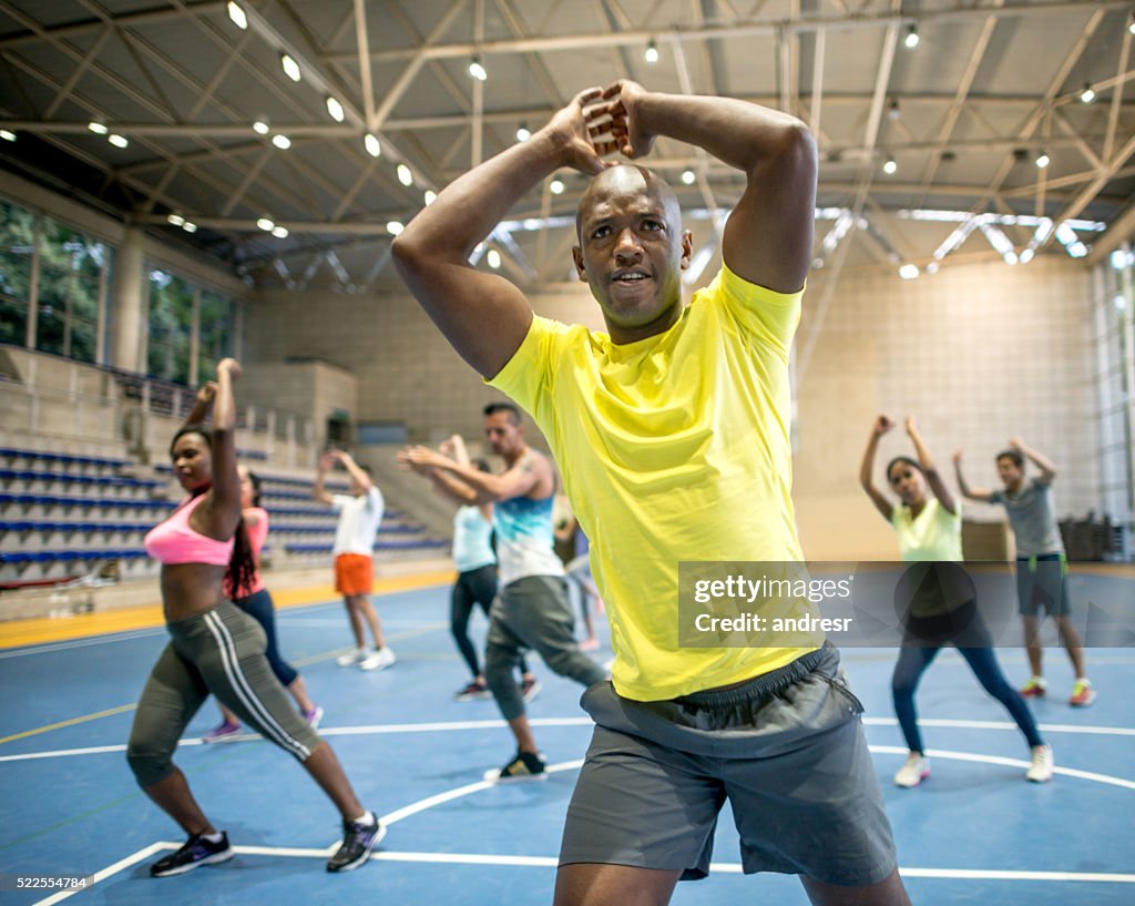 People in an aerobics class at the gym