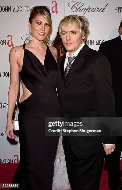 Actress Meredith Ostrum and actor Nick Rhodes arrive at the 13th Annual Elton John Aids Foundation Academy Awards Viewing Party at the Pacific Design...