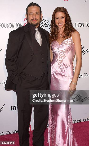 Actress Shannon Elizabeth and husband Joseph Reitman arrive at the 13th Annual Elton John Aids Foundation Academy Awards Viewing Party at the Pacific...