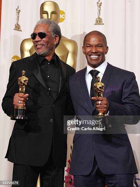 Best supporting actor Morgan Freeman and best actor Jamie Foxx pose backstage with their Oscar awards during the 77th Annual Academy Awards on...