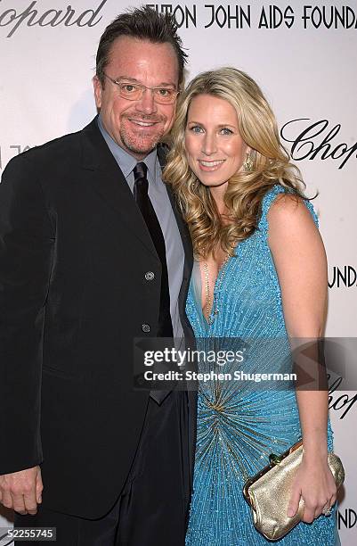 Actor Tom Arnold and guest arrives at the 13th Annual Elton John Aids Foundation Academy Awards Viewing Party at the Pacific Design Center on...