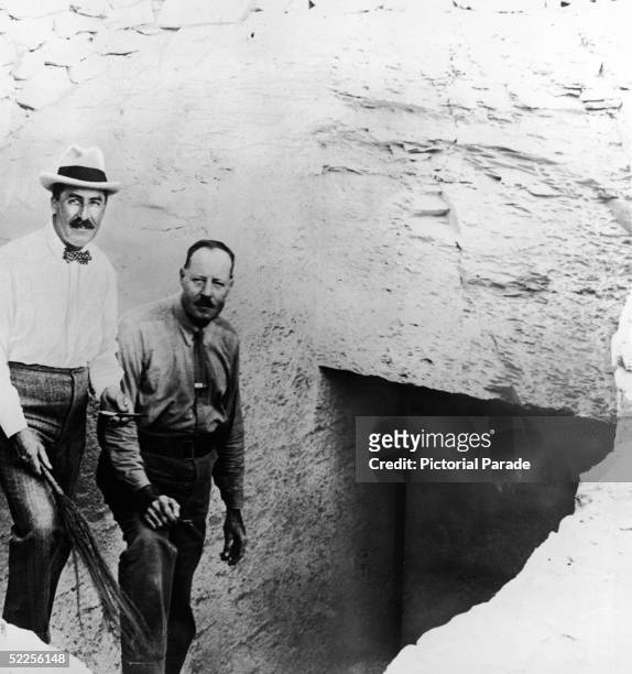 British Egyptologist Howard Carter stands with his assistant Arthur Callender on the steps leading down to the entrance to the tomb of Pharaoh...