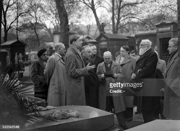 French Gerard Bauer reads a message of Colette in front of the grave of Jules and Edmond de Goncourt, surrounded by academicians of Academie Goncourt...