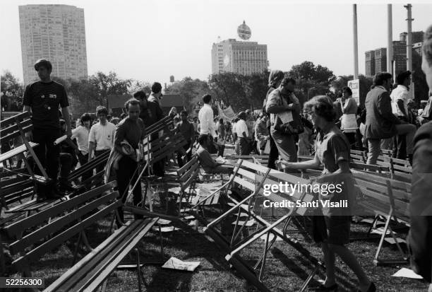 People survey the damage done to Grant Park after riots broke out during a protest of the 1968 Democratic National Convention, Chicago, Illinois,...
