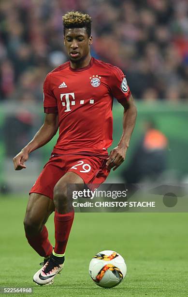 Bayern Munich's French defender Kingsley Coman runs with the ball during the German Cup DFB Pokal semi-final football match FC Bayern Munich v Werder...