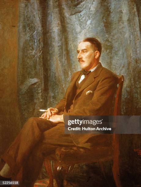 Painted portrait of British archaeologist, discoverer of Pharaoh Tutankhamen's tomb, Howard Carter as he sits in a chair and holds a cigarette, early...