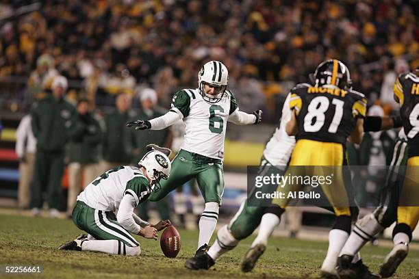 Kicker Doug Brien of the New York Jets attempts to score off a hold by punter Toby Gowin during the game against the Pittsburgh Steelers on December...