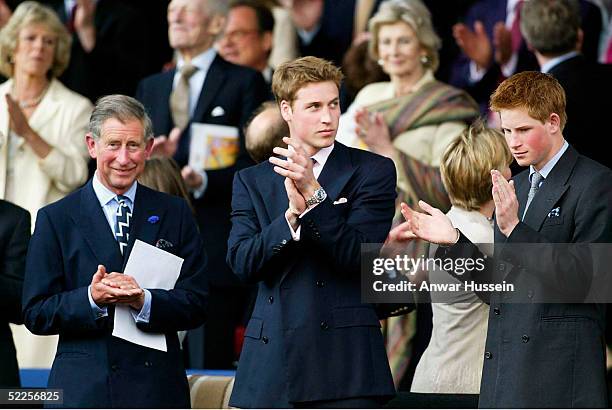 The Prince of Wales, Prince William and Prince Harry, with Camilla Parker-Bowles in the background, enjoy a pop concert to celebrate the Queen's...