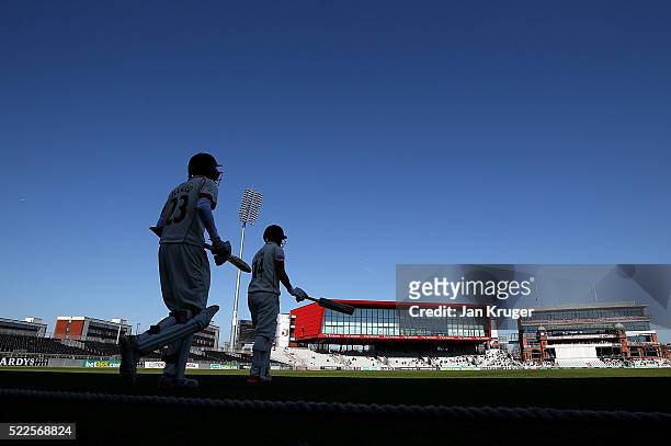 Karl Brown and Haseeb Hameed of Lancashire make their way out to bat during day four of the Specsavers County Championship Division One match between...