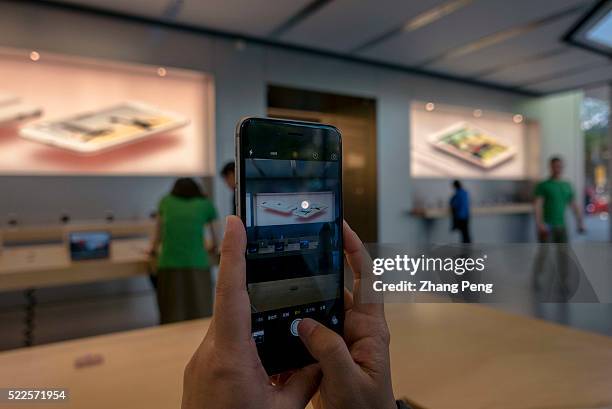 Chinese customer is trying out an iPhone SE in an Apple store located on Huaihai road. In China, Apple booked 3.4 million pre-orders for the iPhone...