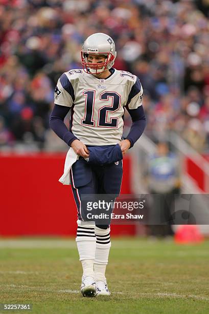 Tom Brady of the New England Patriots stands on the field during the game against the Cincinnati Bengals at Gillette Stadium on December 12, 2004 in...