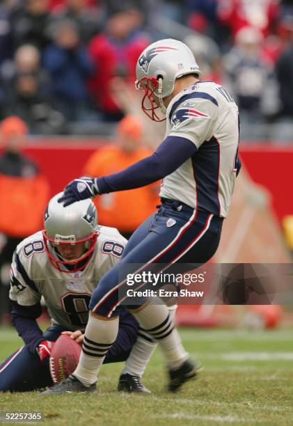 Adam Vinatieri of the New England Patriots attempts a field goal from the hold of Josh Miller during the game against the Cincinnati Bengals at...