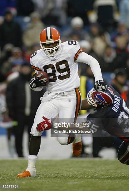 Richard Alston of the Cleveland Browns is nearly tackled by Joe Burns of the Buffalo Bills during the game on December 12, 2004 at Ralph Wilson...