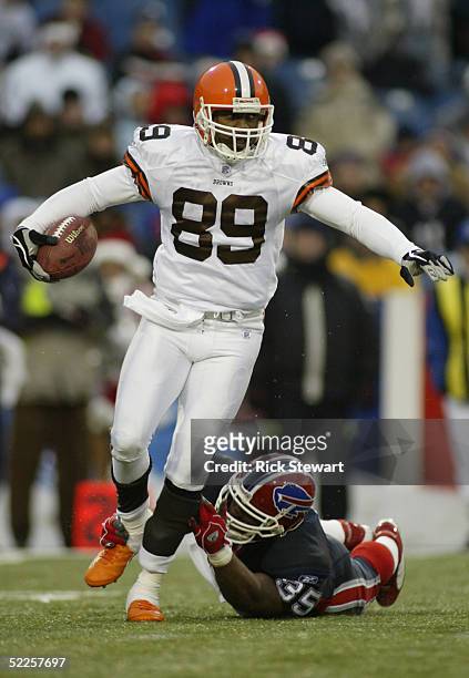 Richard Alston of the Cleveland Browns is nearly tackled by Joe Burns of the Buffalo Bills during the game on December 12, 2004 at Ralph Wilson...