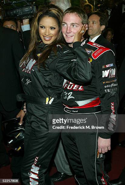 Actress Traci Bingham and NASCAR driver Shane Hmiel arrive at the 15th Annual "Night of 100 Stars" Oscar Party at the Beverly Hills Hotel on February...