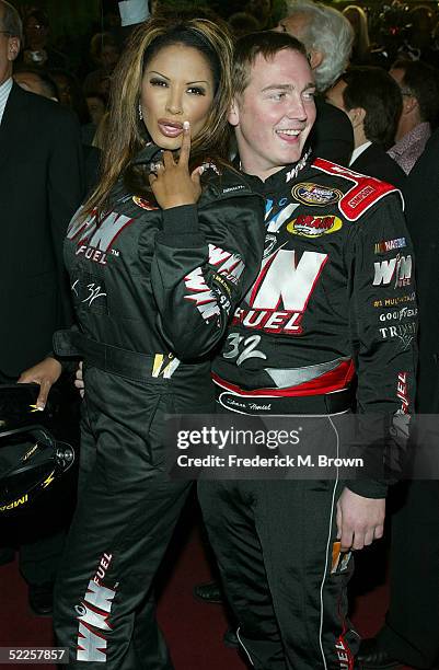 Actress Traci Bingham and NASCAR driver Shane Hmiel arrive at the 15th Annual "Night of 100 Stars" Oscar Party at the Beverly Hills Hotel on February...