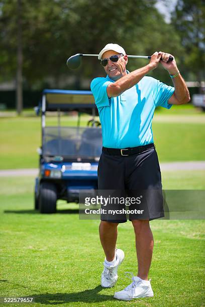 senior golfer tee off - golf driver stock pictures, royalty-free photos & images