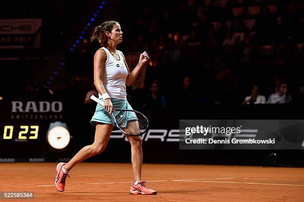 Julia Goerges of Germany celebrates a point in her match against Alize Cornet of France during Day 3 of the Porsche Tennis Grand Prix at...