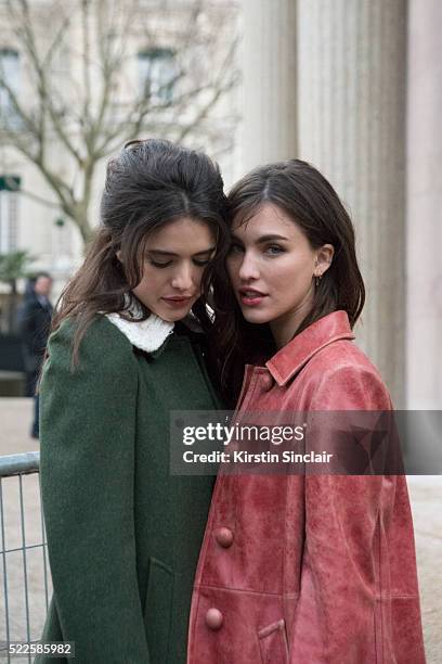 Actress Rainey Qualley weraing Miu Miu with her sister Model and Acrtress Margaret Qualley also wearing Miu Miu on day 9 during Paris Fashion Week...