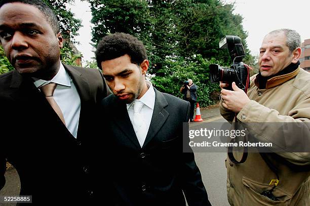 Footballer Jermaine Pennant arrives with body gaurd at Aylesbury Magistrates Court on March 1, 2005 in Buckinghamshire, England. The Arsenal...