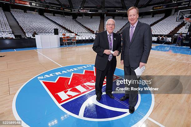 American sportscaster Gary Gerould and Sacramento Kings broadcaster Grant Napear pose for a photo in front othe Sacramento Kings logo prior to the...