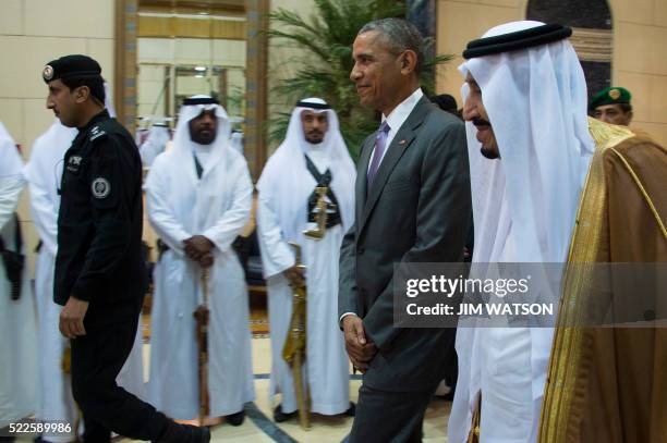 President Barack Obama walks with King Salman bin Abdulaziz Al-Saud of Saudi Arabia at Erga Palace in Riyadh, April 20, 2016. Obama arrived in Saudi...