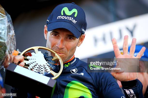 Alejandro Valverde of Spain and Movistar celebrates with the trophy on the podium after winning the 80th La Fleche Wallonne, a 196 km race from...
