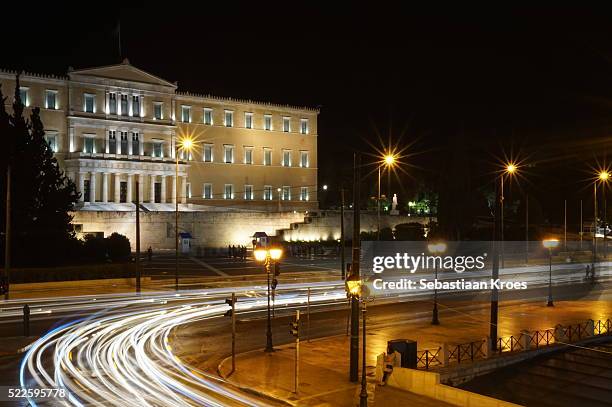 hellenic parliament with long exposure, traffic, athens, greece - greek parliament stock pictures, royalty-free photos & images