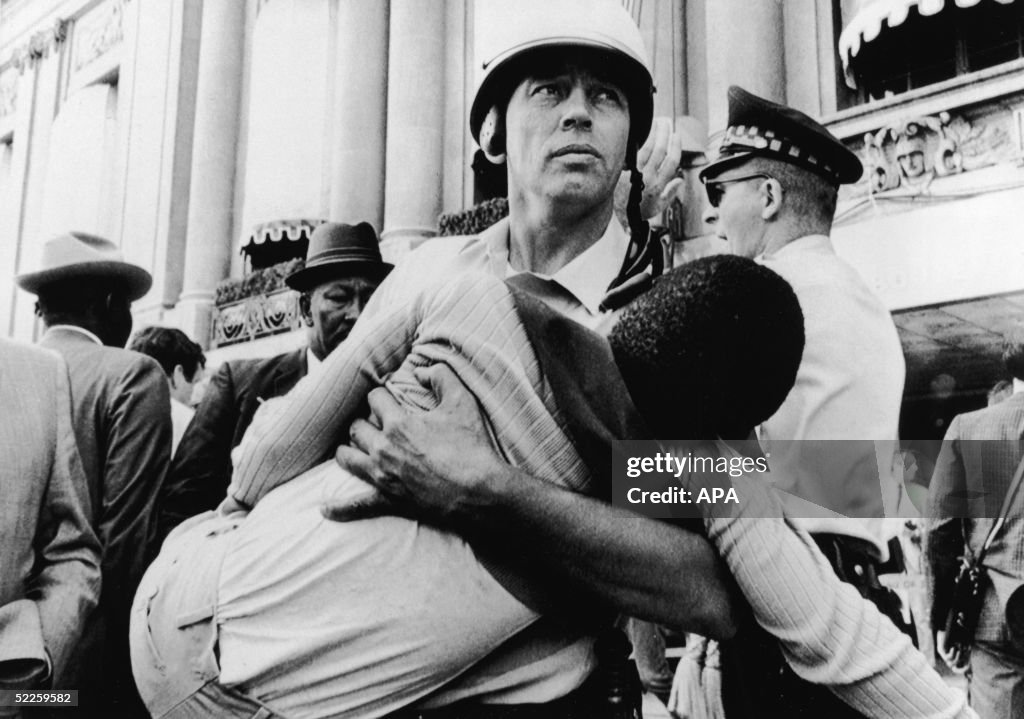 Cop Carries Child Protestor At 1968 Democratic National Convention