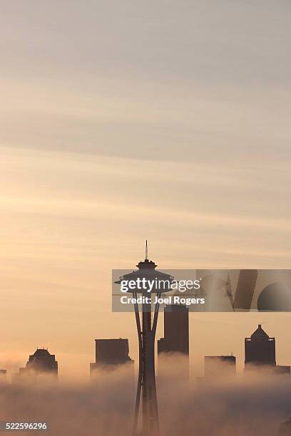 space needle and seattle skyline in the fog - space needle stock pictures, royalty-free photos & images