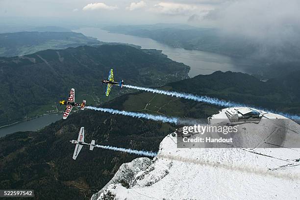 Martin Sonka of the Czech Republic flies in formation with Hannes Arch of Austria and Petr Kopfstein of the Czech Republic over the Schafberg prior...