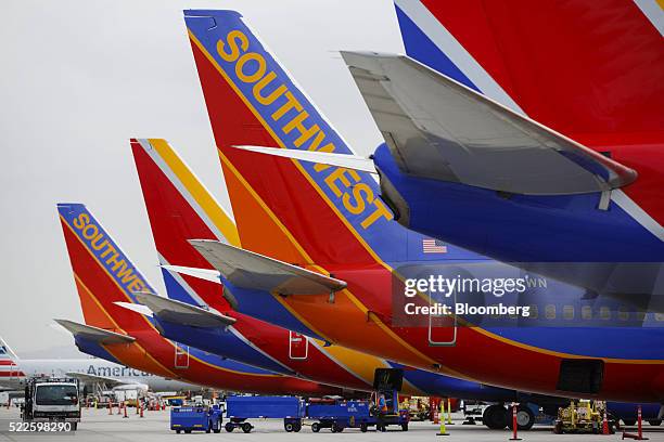 Southwest Airlines Co. Boeing Co. 737 aircraft sit on the tarmac at John Wayne Airport in Santa Ana, California, U.S., on Thursday, April 14, 2016....