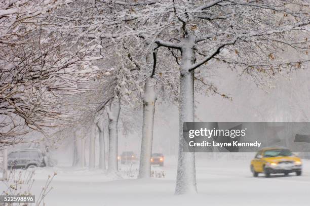 taxi in heavy snow storm - minneapolis winter stock pictures, royalty-free photos & images