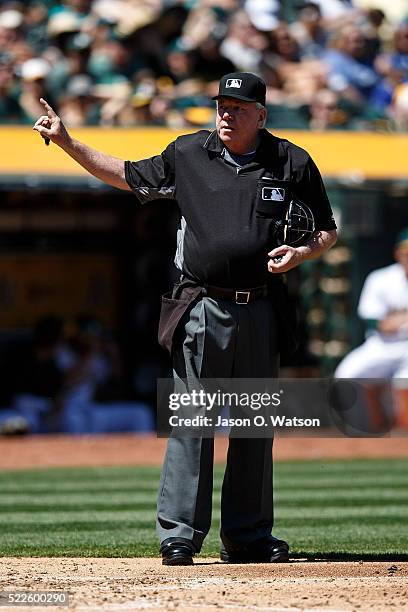 Umpire Brian Gorman stands behind home plate during the third inning between the Oakland Athletics and the Kansas City Royals at the Oakland Coliseum...