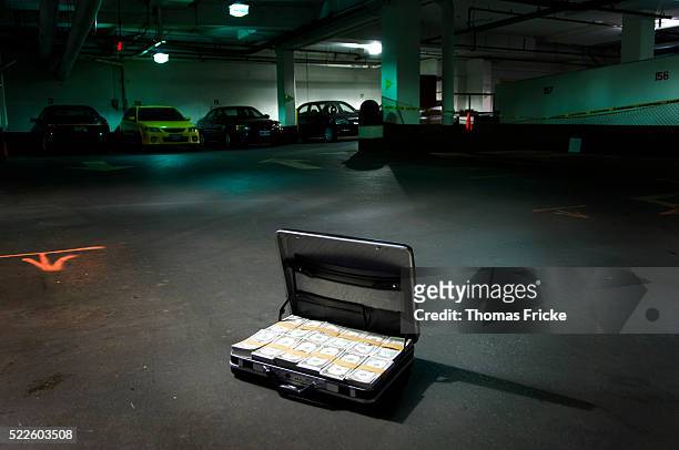 open suitcase full of money - 汚職 ストックフォトと画像