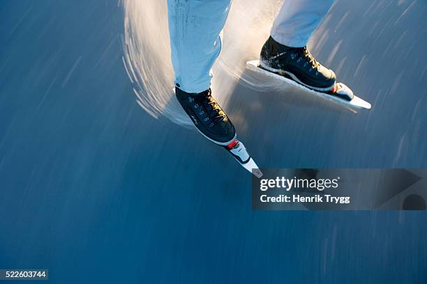 skater preparing to do a stop turn - ice skating stock pictures, royalty-free photos & images