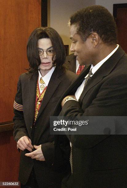 Michael Jackson and brother Jackie Jackson leave the courtroom during a break during the second day of Michael Jackson's child molestation trial at...