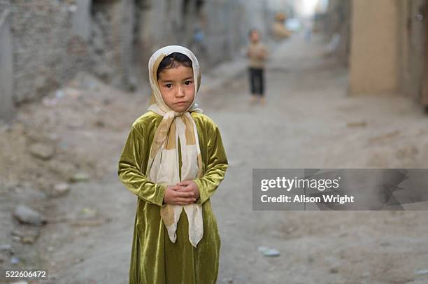 girl standing in street - afghan girl stock pictures, royalty-free photos & images