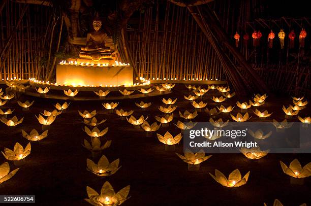 candles and khom loy lanterns at loi krathong festival - khom loy stock pictures, royalty-free photos & images