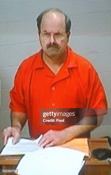 Serial murder suspect Dennis Rader appears on a video screen as he makes his first court appearance, via video feed from the Sedgwick County Jail,...