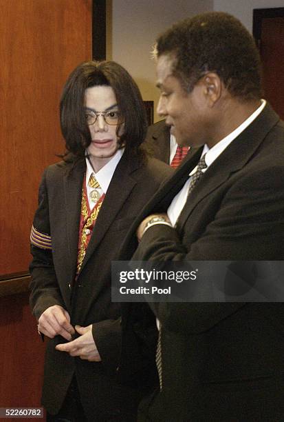 Michael Jackson and brother Jermaine Jackson leave the courtroom during a break during the second day of Michael Jackson's child molestation trial at...