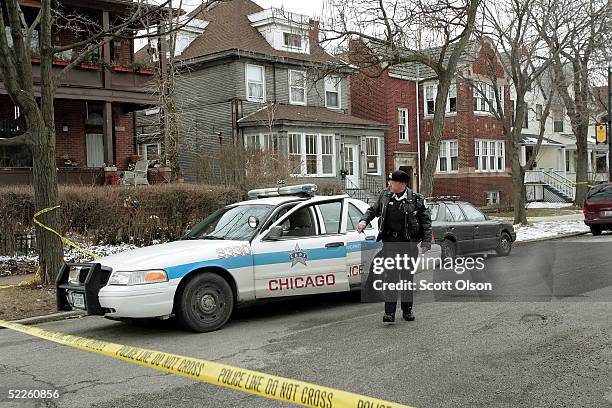 Chicago Police officer guards home where Michael Lefkow and Donna Humphrey, the husband and mother of United States District Judge Joan Lefkow, were...