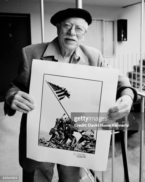 Photographer Joe Rosenthal poses July 1, 200O in San Francisco, California with his Pulitzer Prize-winning photograph of U.S. Marines raising the...