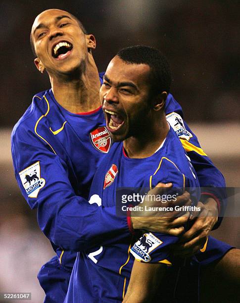 Ashley Cole of Arsenal is congratulated by Gael Clichy after scoring the winning penalty during the FA Cup Fifth Round Replay match between Sheffield...