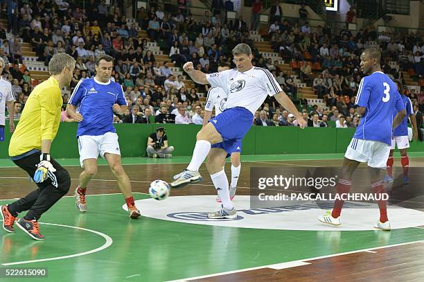 Former French International player and Stade Toulousain's general manager Fabien Pelous and from the CDES All Stars Managers team fights for the ball...