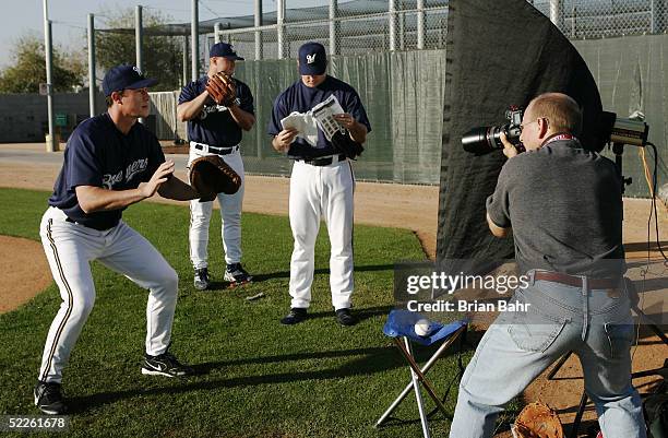 Catcher Chad Moeller, Rick Helling, and Ricky Bottalico of the Milwaukee Brewers work their poses for a baseball card photographer during Brewers...