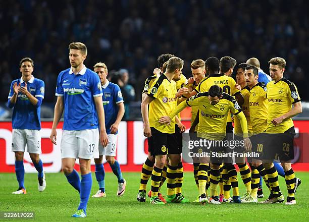 Gonzalo Castro of Dortmund celebrates with team mates after scoring his teams first goal during the DFB Cup semi final match between Hertha BSC...