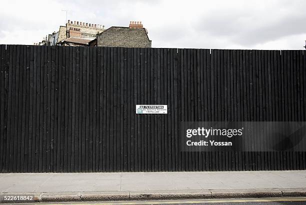 "no flyposting" sign on fence - bill posting stock pictures, royalty-free photos & images