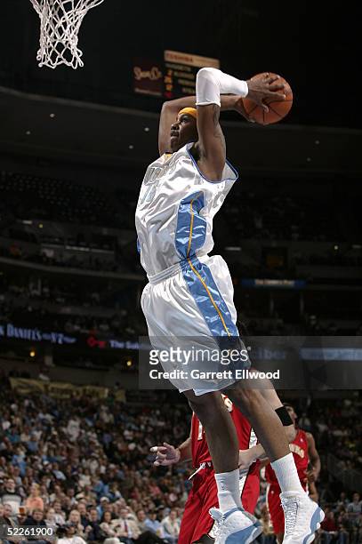 Carmelo Anthony of the Denver Nuggets dunks against the Atlanta Hawks on March 1, 2005 at the Pepsi Center in Denver, Colorado. NOTE TO USER: User...