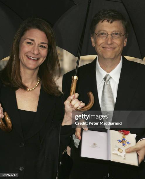 Microsoft founder Bill Gates and his wife Melinda pose for photographers outside Buckingham Palace, March 2, 2005 in London, England. Mr Gates...